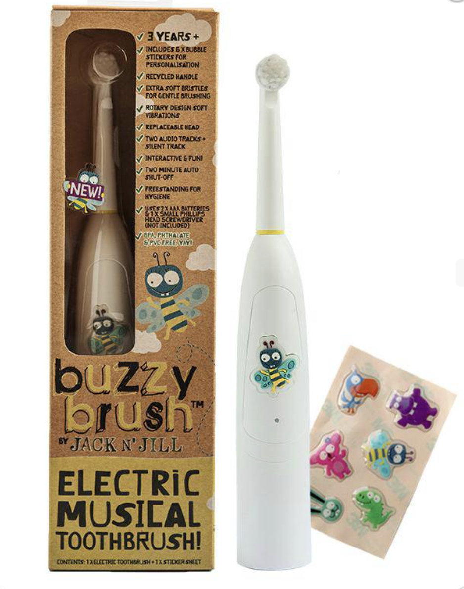 Buzzy brush electrical toothbrush in a cardboard box with another unpackaged white matching toothbrush to the right