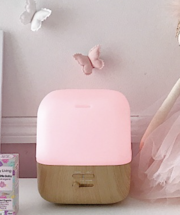 pink and wooden ultrasonic vaporiser in a bedroom