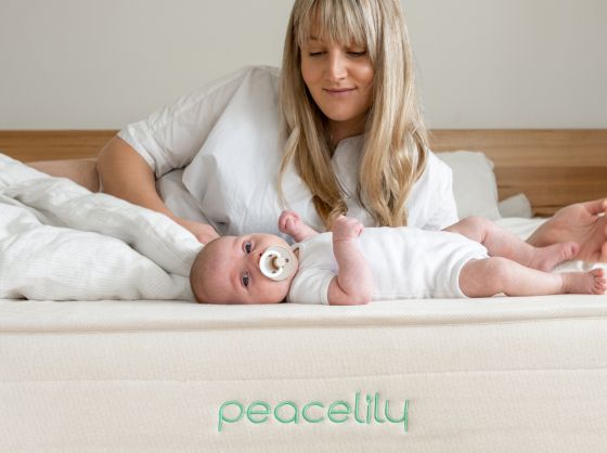 Peacelily mattress. Mother and infant resting in bed